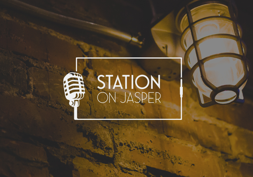 Station On Jasper logo over brick wall background - SAVIAN, Edmonton Digital Marketing